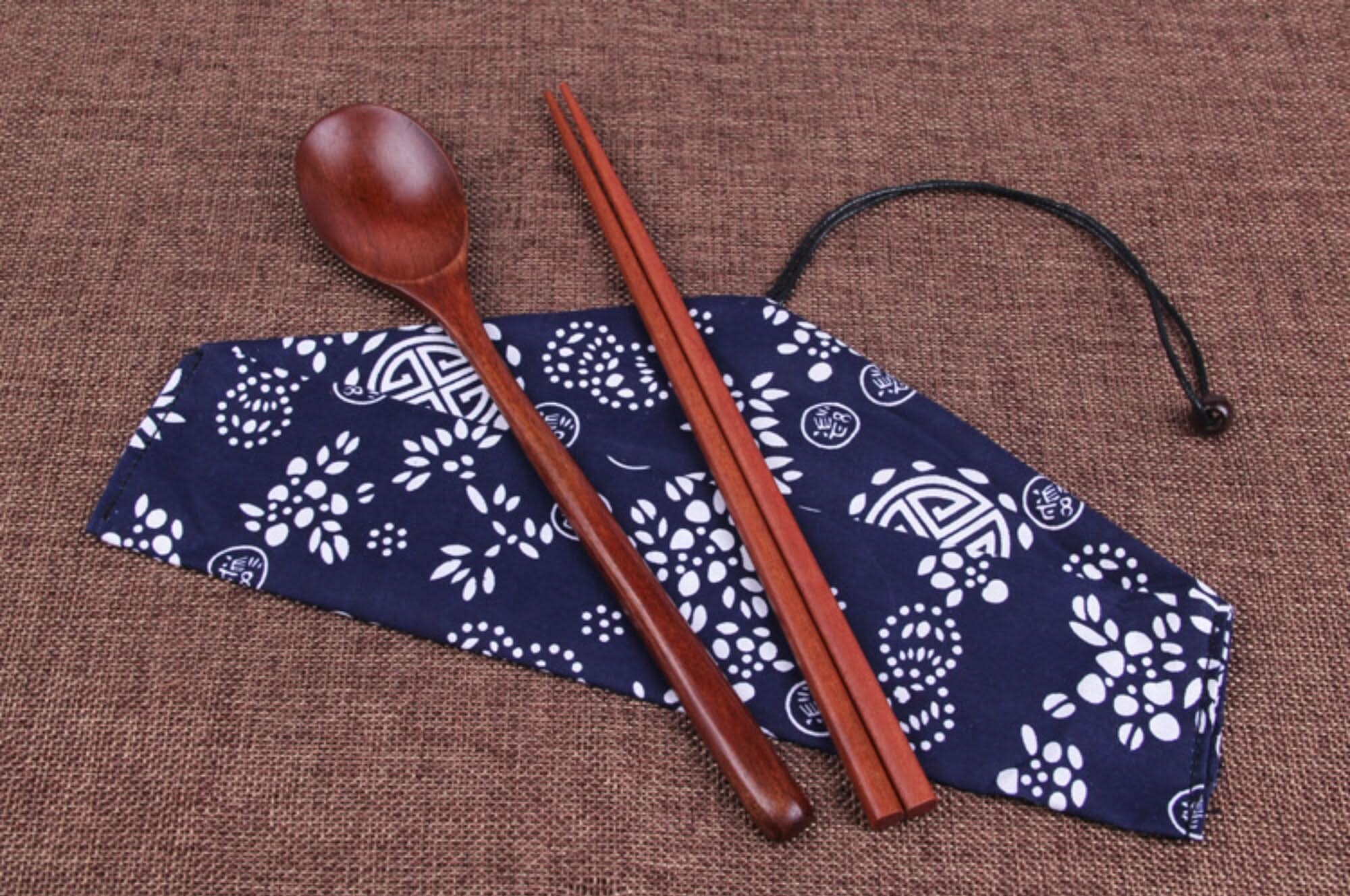 Japanese Wood Cooking Utensils with fabric case: natural wood spoon and chopsticks.